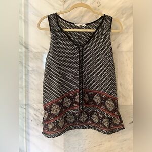 Patterned chiffon sleeveless top with crop front and longer length in the back